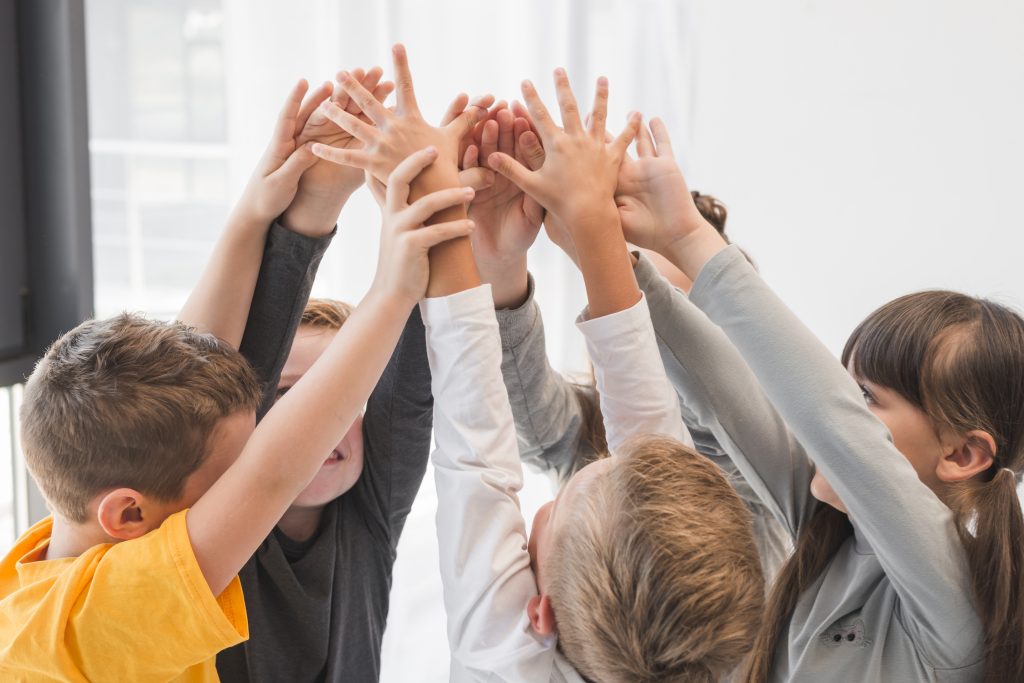 Children With Their Hands Up