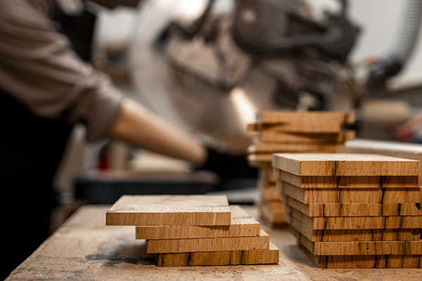 Side View Female Carpenter Studio Using Electric Saw